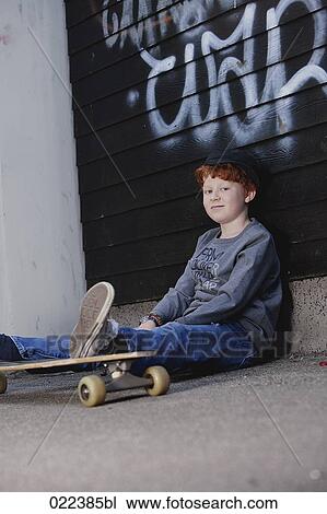 portrait of red haired boy sitting on ground View Large Photo Image Stock Image - portrait of red haired boy sitting on ground. Fotosearch