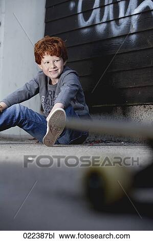 portrait of red haired boy sitting on ground View Large Photo Image Stock Image - portrait of red haired boy sitting on ground. Fotosearch