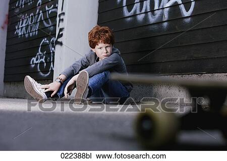 portrait of red haired boy sitting on ground View Large Photo Image Stock Image - portrait of red haired boy sitting on ground. Fotosearch