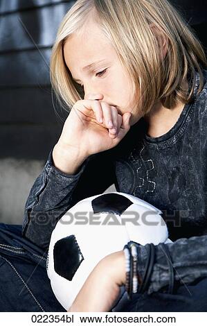 portrait of sulking blond boy with football View Large Photo Image Stock Image - portrait of sulking blond boy with football. Fotosearch