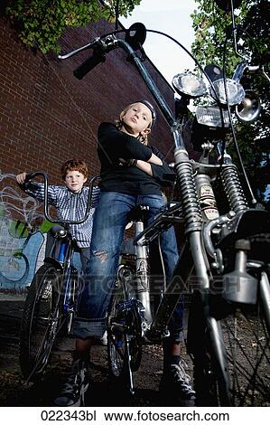 portrait of two young boys on chopper bicycles View Large Photo Image Stock Image - portrait of two young boys on chopper bicycles. Fotosearch