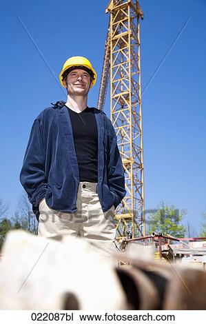 Stock Image - portrait of worker on construction site. Fotosearch