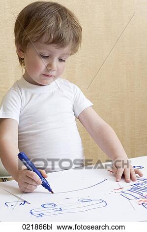 portrait of young boy drawing with blue felt tip pen View Large Photo Image Stock Image - portrait of young boy drawing with blue felt tip pen. Fotosearch