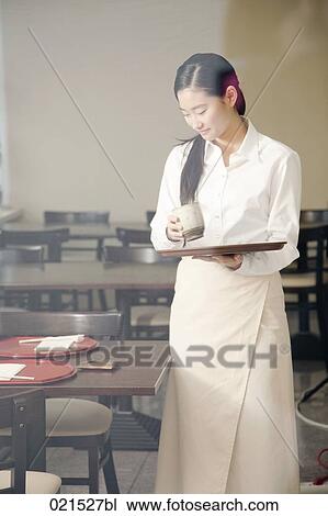 portrait of young japanese waitress setting table at restaurant View Large Photo Image Stock Image - portrait of young japanese waitress setting table at restaurant. Fotosearch