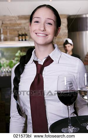 portrait of young waitress serving wine View Large Photo Image Stock Image - portrait of young waitress serving wine. Fotosearch