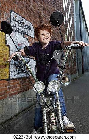 red haired boy on chopper bicycle View Large Photo Image Stock Image - red haired boy on chopper bicycle. Fotosearch