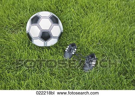 still life of ball and tiny football boots View Large Photo Image Stock Image - still life of ball and tiny football boots. Fotosearch