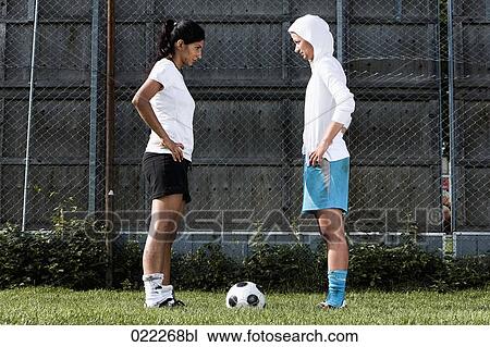 two female football players tanding face to face View Large Photo Image Stock Image - two female football players tanding face to face. Fotosearch