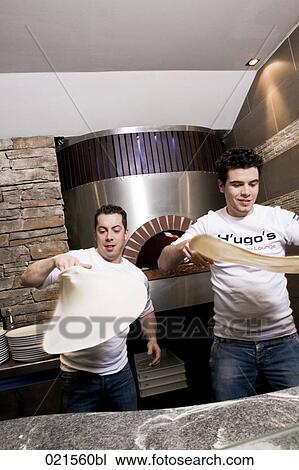 two pizza bakers making dough View Large Photo Image Stock Image - two pizza bakers making dough. Fotosearch