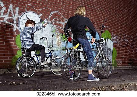 two young boys sitting on chopper bicycles View Large Photo Image Stock Image - two young boys sitting on chopper bicycles. Fotosearch