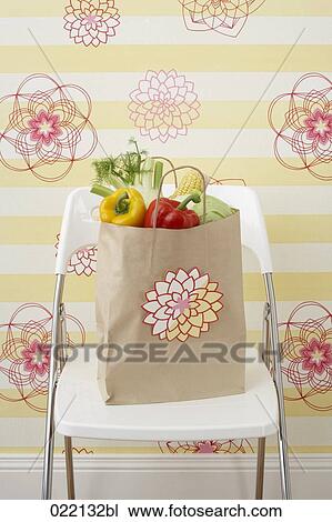 vegetables in paper bag on chair View Large Photo Image Stock Image - vegetables in paper bag on chair. Fotosearch
