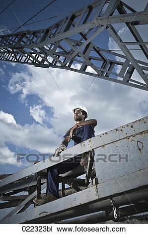 worker taking break on excavator View Large Photo Image Stock Image - worker taking break on excavator. Fotosearch