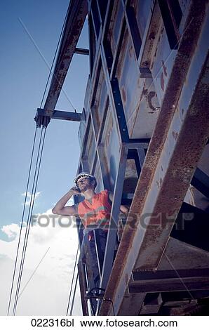 worker talking on mobile phone View Large Photo Image Stock Image - worker talking on mobile phone. Fotosearch