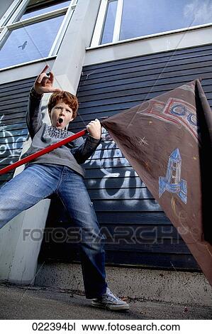 young boy holding flag and gesturing View Large Photo Image Stock Image - young boy holding flag and gesturing. Fotosearch