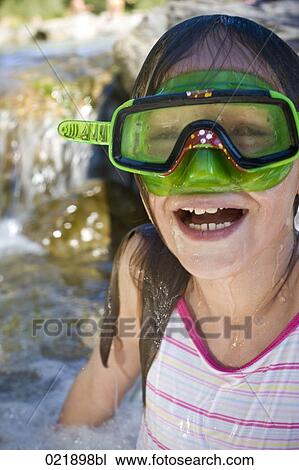 young girl in water wearing diving goggles View Large Photo Image Stock Image - young girl in water wearing diving goggles. Fotosearch