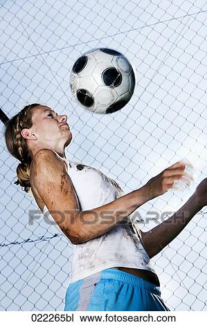 young woman practising with football View Large Photo Image Stock Image - young woman practising with football. Fotosearch