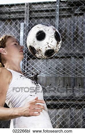 young woman practising with football View Large Photo Image Stock Image - young woman practising with football. Fotosearch