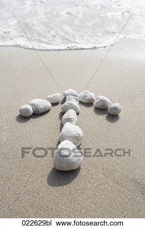 arrows made of stone showing direction to beach View Large Photo Image Stock Image - arrows made of stone showing direction to beach. Fotosearch