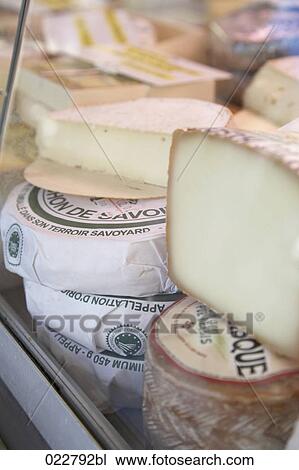 cheese on display at market View Large Photo Image Stock Image - cheese on display at market. Fotosearch