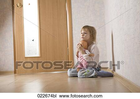child with doll sitting alone in corridor View Large Photo Image Stock Image - child with doll sitting alone in corridor. Fotosearch
