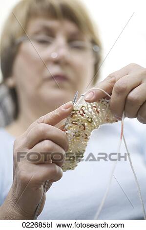 close-up of mature woman knitting View Large Photo Image Stock Image - close-up of mature woman knitting. Fotosearch