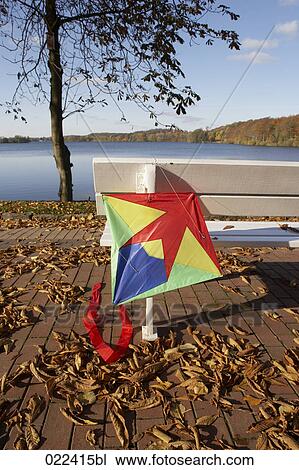 colourful kite on park bench near lake View Large Photo Image Stock Image - colourful kite on park bench near lake. Fotosearch