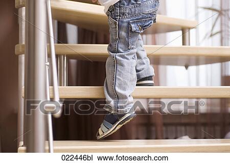 detail of young boy climbing stairs at home View Large Photo Image Stock Image - detail of young boy climbing stairs at home. Fotosearch