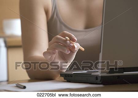 detail of young woman working with laptop computer View Large Photo Image Stock Image - detail of young woman working with laptop computer. Fotosearch