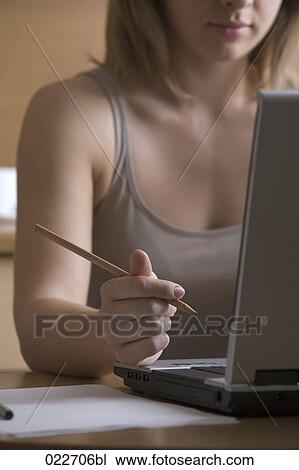 detail of young woman working with laptop computer View Large Photo Image Stock Image - detail of young woman working with laptop computer. Fotosearch