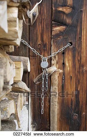 door of alpine hut closed with padlock View Large Photo Image Stock Image - door of alpine hut closed with padlock. Fotosearch