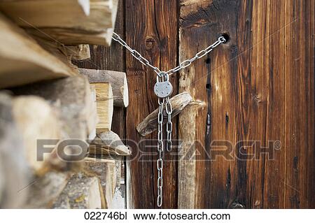 door of alpine hut closed with padlock View Large Photo Image Stock Image - door of alpine hut closed with padlock. Fotosearch