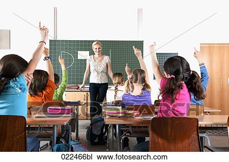 female teacher in front of class View Large Photo Image Stock Image - female teacher in front of class. Fotosearch
