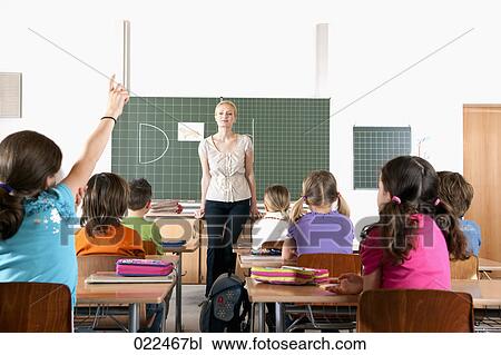 female teacher in front of class View Large Photo Image Stock Image - female teacher in front of class. Fotosearch