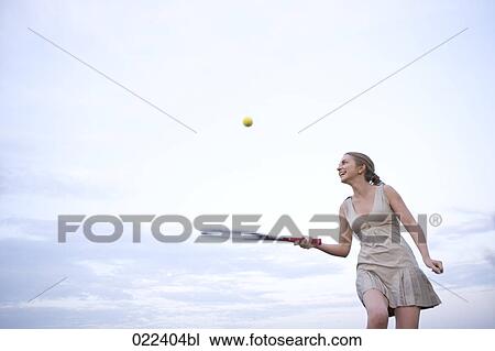 female tennis player balancing ball on racquet View Large Photo Image Stock Image - female tennis player balancing ball on racquet. Fotosearch