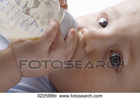 headshot of baby boy drinking from baby bottle View Large Photo Image Stock Image - headshot of baby boy drinking from baby bottle. Fotosearch