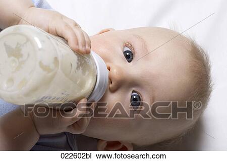 headshot of baby boy drinking from baby bottle View Large Photo Image Stock Image - headshot of baby boy drinking from baby bottle. Fotosearch