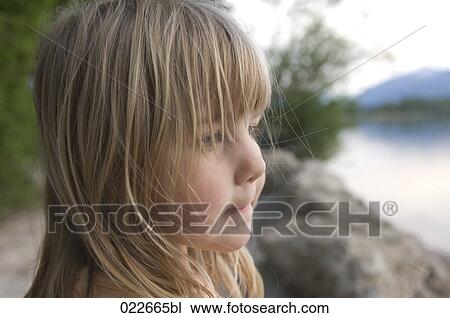 headshot of young girl standing on riverbank View Large Photo Image Stock Image - headshot of young girl standing on riverbank. Fotosearch