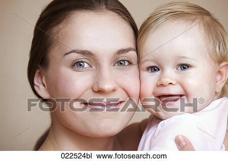 headshot of young mother with baby daughter View Large Photo Image Stock Image - headshot of young mother with baby daughter. Fotosearch