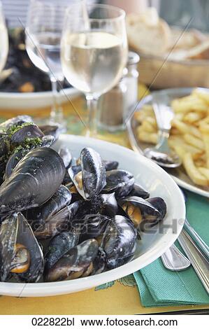 plate with mussels on restaurant table View Large Photo Image Stock Image - plate with mussels on restaurant table. Fotosearch