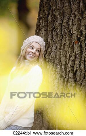 portrait of teenage girl leaning against tree View Large Photo Image Stock Image - portrait of teenage girl leaning against tree. Fotosearch