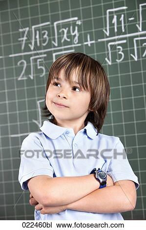 portrait of young boy in classroom in front pof blackboard View Large Photo Image Stock Image - portrait of young boy in classroom in front pof blackboard. Fotosearch