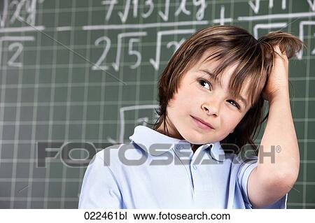portrait of young boy in classroom in front pof blackboard View Large Photo Image Stock Image - portrait of young boy in classroom in front pof blackboard. Fotosearch