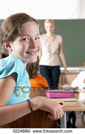 portrait of young girl in class View Large Photo Image Stock Image - portrait of young girl in class. Fotosearch