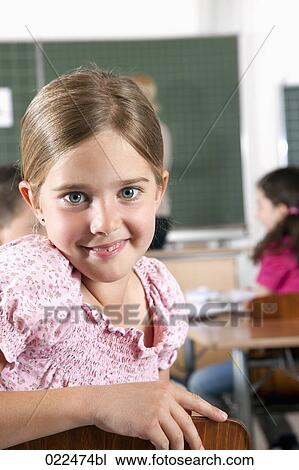 portrait of young girl in classroom View Large Photo Image Stock Image - portrait of young girl in classroom. Fotosearch