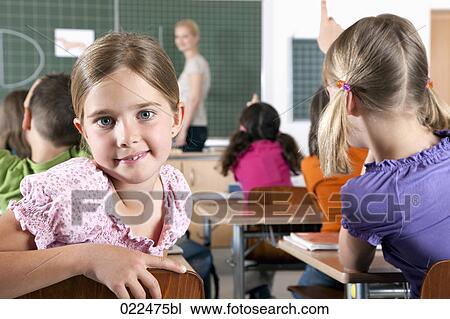portrait of young girl in classroom View Large Photo Image Stock Image - portrait of young girl in classroom. Fotosearch