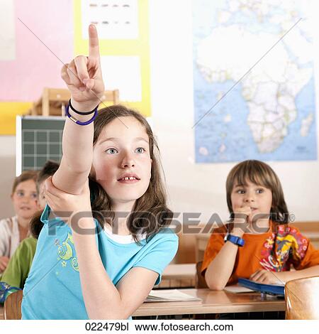portrait of young girl raising her finger in classroom View Large Photo Image Stock Image - portrait of young girl raising her finger in classroom. Fotosearch