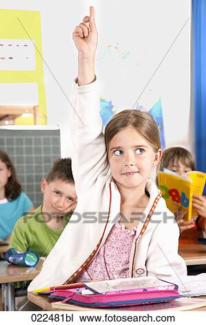 portrait of young girl raising his finger in classroom View Large Photo Image Stock Image - portrait of young girl raising his finger in classroom. Fotosearch