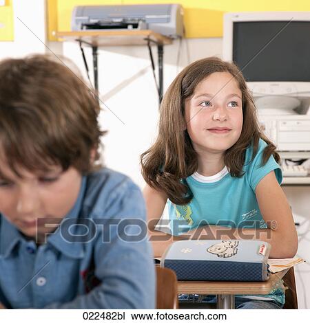 portrait of young girl sitting in classroom View Large Photo Image Stock Image - portrait of young girl sitting in classroom. Fotosearch
