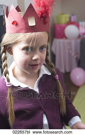 portrait of young girl wearing paper crown at birthday party View Large Photo Image Stock Image - portrait of young girl wearing paper crown at birthday party. Fotosearch