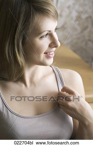 portrait of young woman at home View Large Photo Image Stock Image - portrait of young woman at home. Fotosearch
